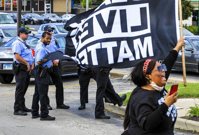 Peaceful protestors can be seen holding signs and chanting Monday, Jun. 1, 2020, at the corner of Larkin Avenue and Jefferson Street while protesting the May 25 killing of George Floyd by former Minneapolis police officer Derek Chauvin.