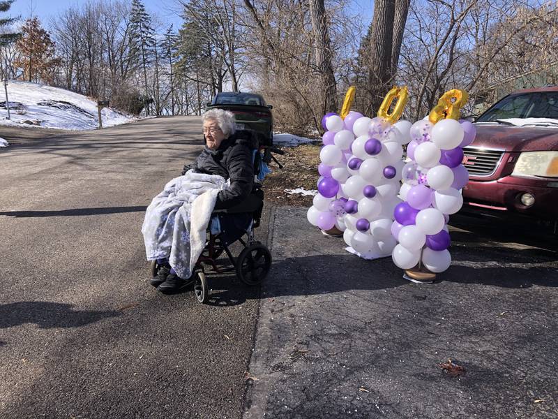 Spring Grove resident Lillian Bennett watches her 108th birthday party parade go by Feb. 24, 2024
