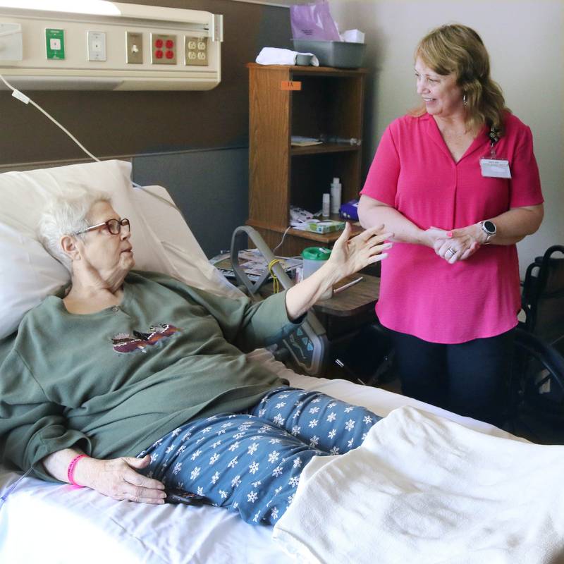 Maretta "Mikki" Bell, 78, one of the first residents to move into the DeKalb County Rehabilitation and Nursing Center’s new transitional care wing, tells Mary Anne Miller, social service director at the facility, what her favorite features are in her new room Wednesday, July 10, 2024, at the center in DeKalb.