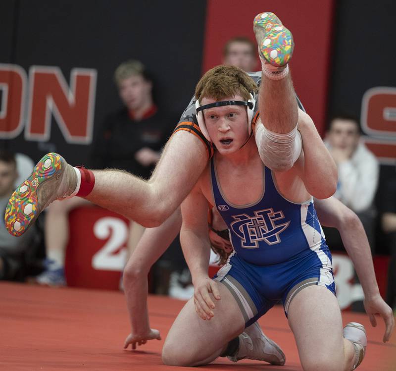 Newman’s Benjamin Geske upends Kewanee’s Joey McGuire in the 165 pound third place match Saturday, Feb. 3, 2024 during the class 1A Fulton wrestling regionals.