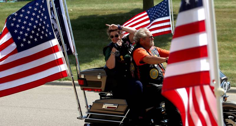 A motorcycle escort approaches as McHenry Community High School hosted a celebration Sunday for veterans returning from an Honor Flight trip to Washington D.C. The Honor Flight trip was coordinated by the Veterans Network Committee of Northern Illinois.