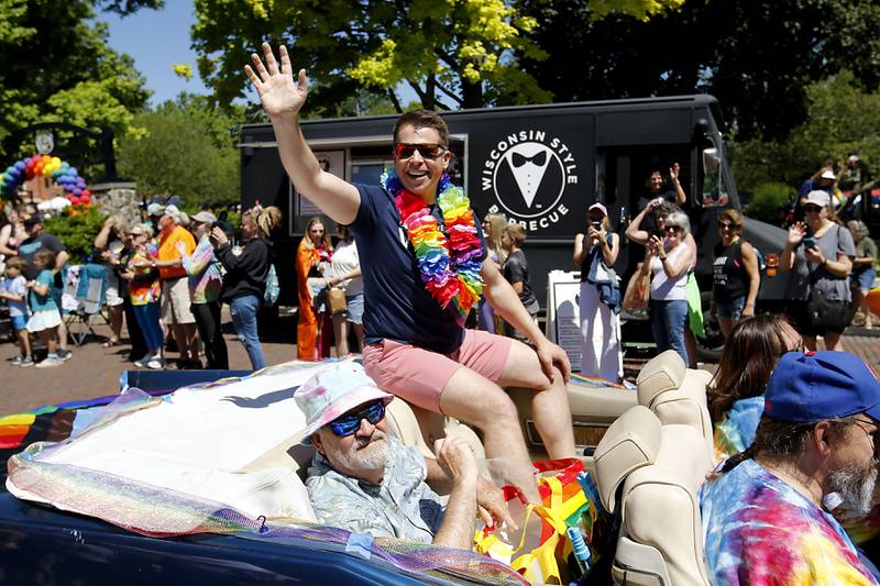 Grand Marshall Sean Lewis waves to the crowd during the Woodstock PrideFest Parade on Sunday, June 9, 2024, around the historic Woodstock Square.