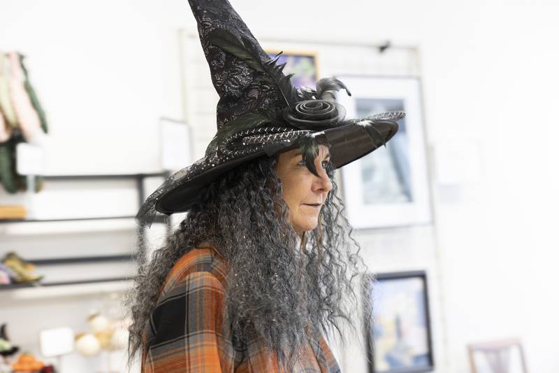 Tracy DuRall dons her best witches cap Thursday, Oct. 12, 2023 while checking out a store in downtown Dixon for Discover Dixon’s Witches Night Out.