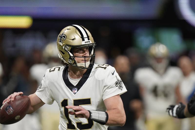 New Orleans Saints quarterback Trevor Siemian (15) works against the Atlanta Falcons during the second half of an NFL football game, Sunday, Jan. 9, 2022, in Atlanta.