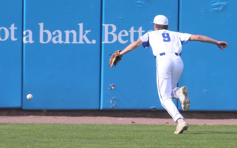 Newman's Joe Oswalt sprints to the wall as the ball soars over his head during the Class 2A semifinal game on Friday, May 31, 2024 at Dozer Park in Peoria.