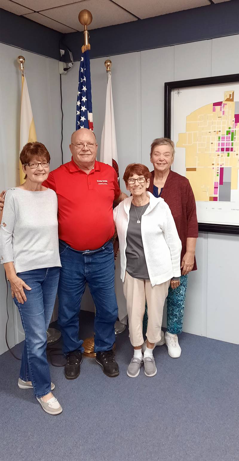 Polo Mayor Doug Knapp, center left, poses for a photo on Sept. 18, 2023, with Polo Women's Club President Sheila Dean, left; club member Mary Cimino, center right; and club Secretary Pat Kuhn after signing a proclamation declaring Sept. 30 to be "GFWC Illinois Polo Women's Club Step Up to End Hunger Day of Service."