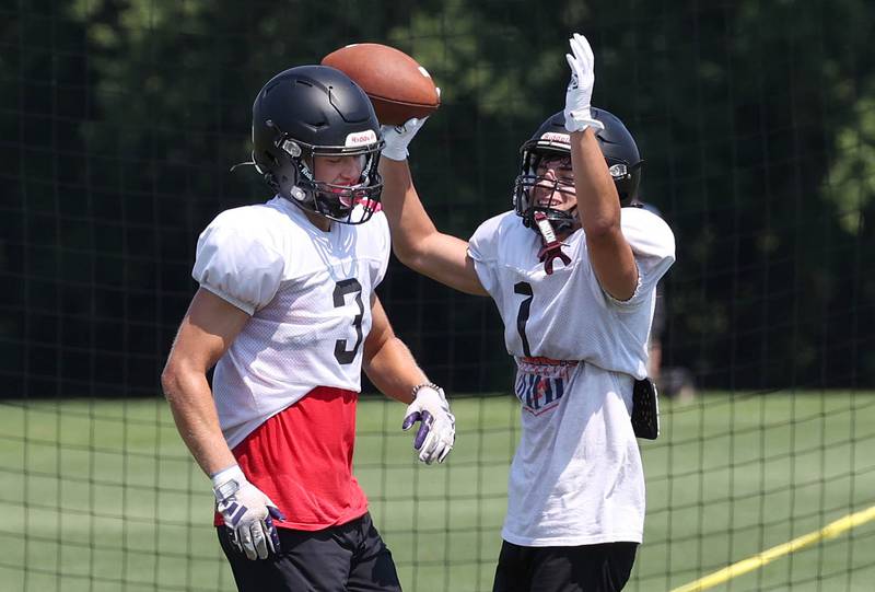 Sycamore’s Carter York (left) and Colton Sharpness celebrate a long pass play Monday, July 15, 2024, during summer football camp at Sycamore High School.