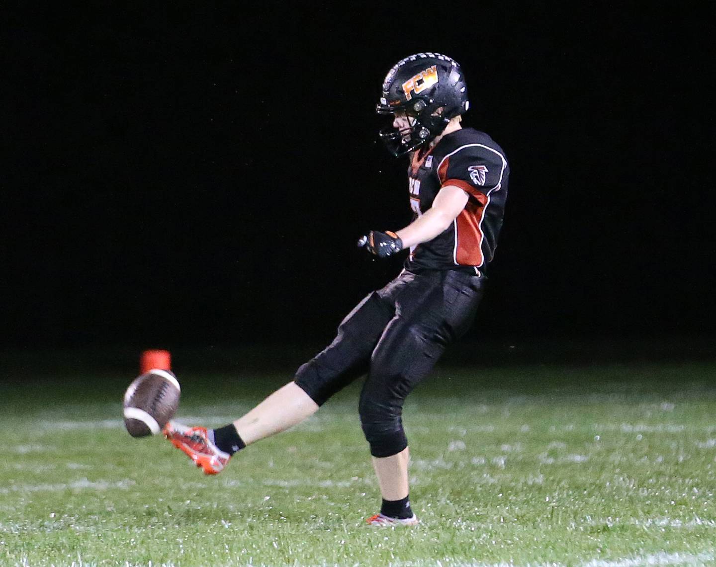 Flanagan-Cornell/Woodland's Connor Decker kicks the ball down the field against South Beloit during the first round of the 8-man football playoffs on Friday, Oct. 27, 2023 in Flanagan.