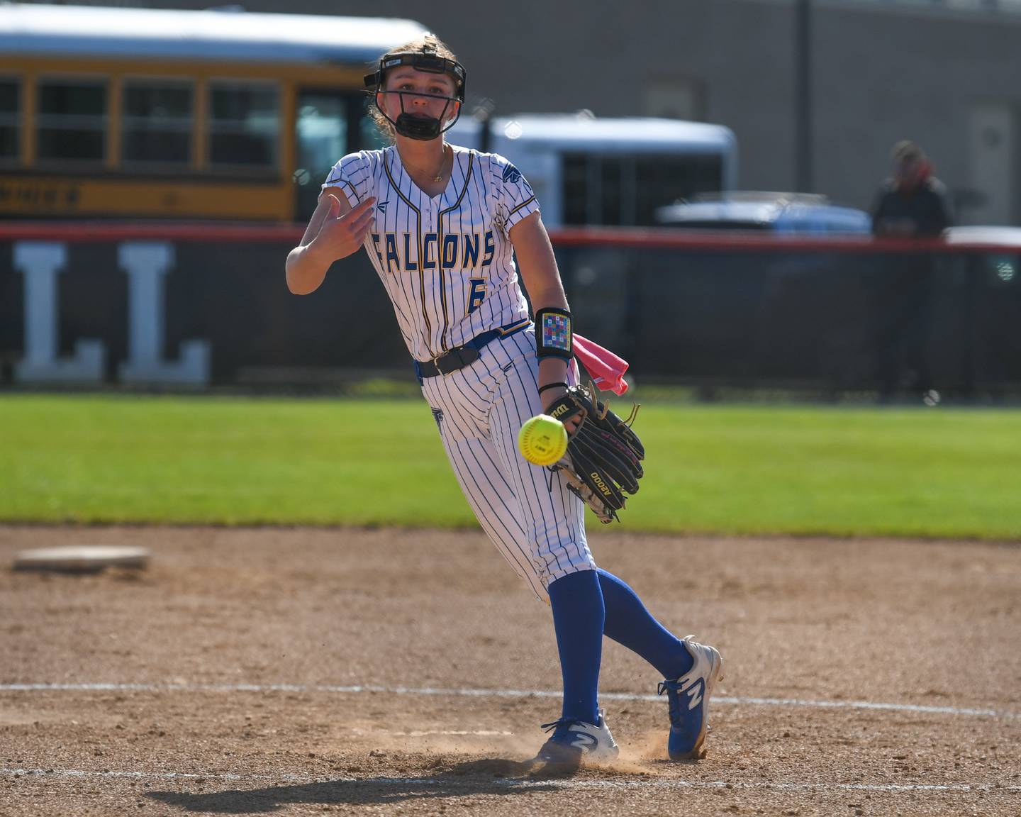 Wheaton North's Erin Metz (6) pitches during an April 2024 game at Wheaton Warrenville South.