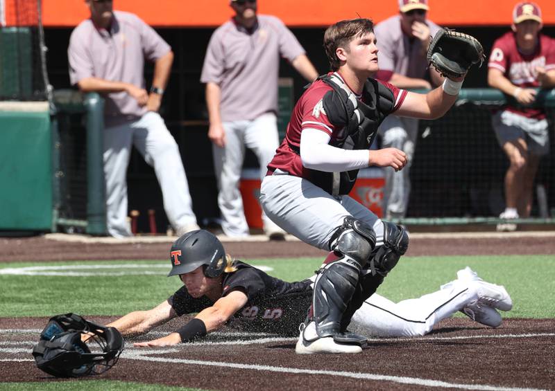 Crystal Lake Central's Nolan Hollander slides in with a run as Morris' Griffin Zweeres waits for the throw during their Class 3A state semifinal game Friday, June 7, 2024, at Duly Health and Care Field in Joliet.