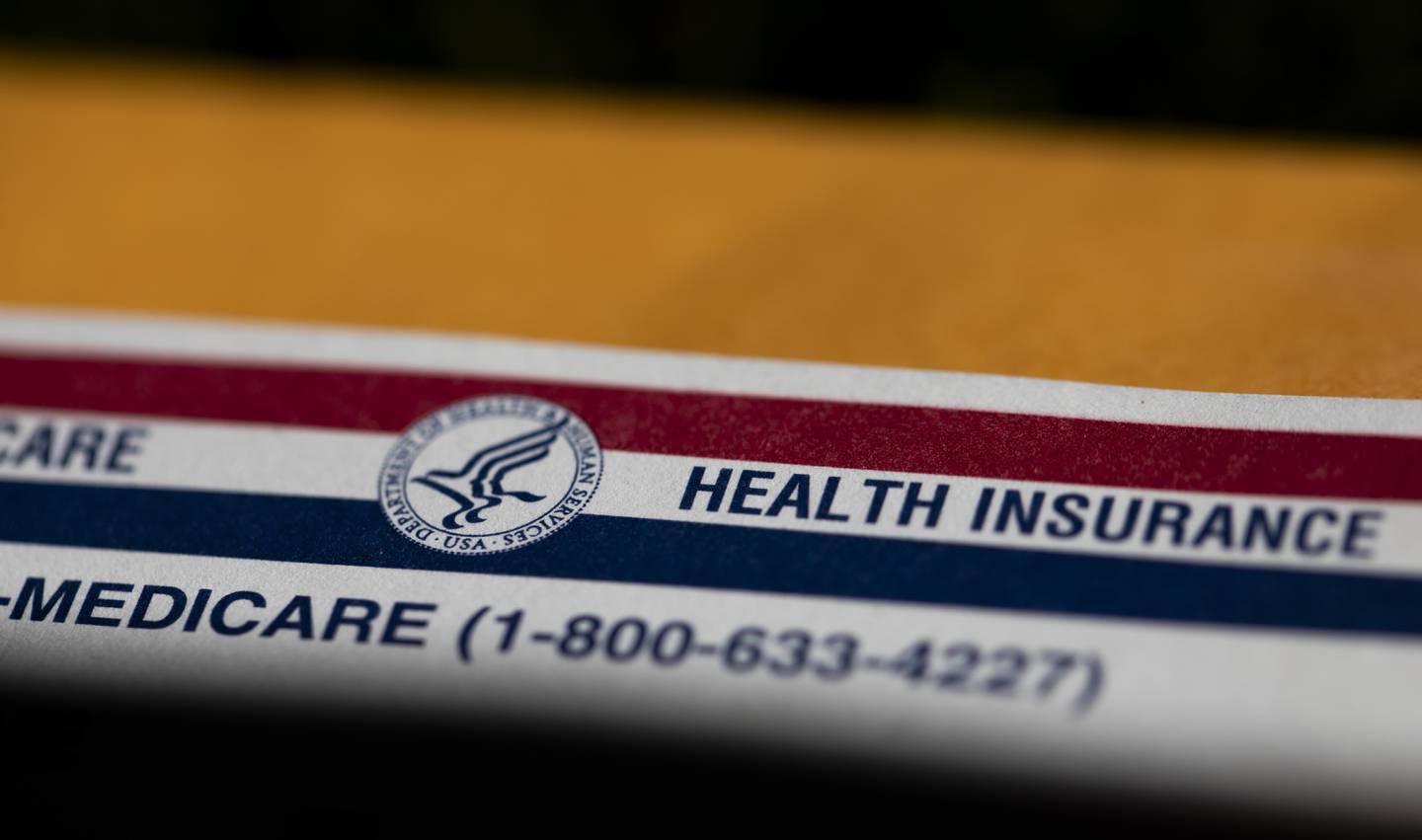 FILE - A shadow is seen across a Medicare card on June 10, 2024, in Portland, Ore. Majorities of Americans favor forgiving all or some of an individual's medical debt if the person is facing hardships, according to a new poll from the University of Chicago Harris School of Public Policy and The Associated Press-NORC Center for Public Affairs Research. (AP Photo/Jenny Kane)