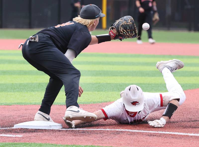 Huntley's Ryan Dabe just gets back to first as DeKalb’s Brodie Farrell takes the throw during their Class 4A DeKalb Regional championship game Friday, May 24, 2024, at Ralph McKinzie Field at Northern Illinois University in DeKalb.
