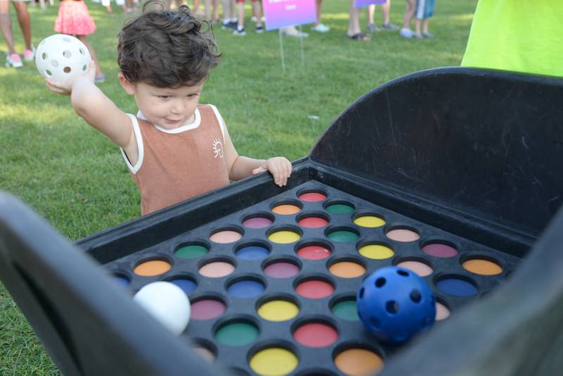 Children including Romeo Herrers of Elmhurst enjoy the games while attending Park Palooza at Berens Park Saturday Aug 19, 2023.