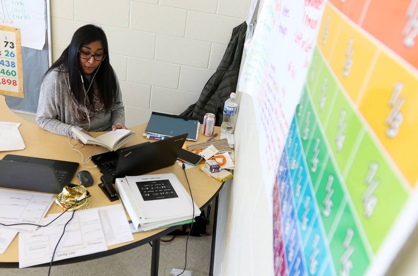 Aurora University student Sunita Andrysiak, a member of the Woodstock Community Unit School District 200 teacher residency program, reads from the book "George's Secret Key to the Universe" Tuesday, March 2, 2021, to her remote students in her fifth-grade dual language English literacy class at Prairiewood Elementary School in Woodstock.