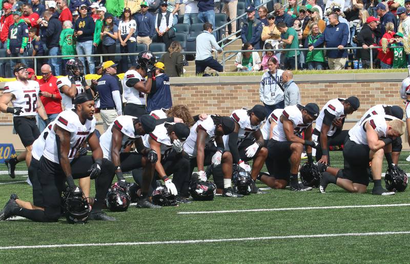 Members of the NIU football team reflect in the end zone before playing Notre Dame on Saturday, Sept. 7, 2024 at Notre Dame Stadium.