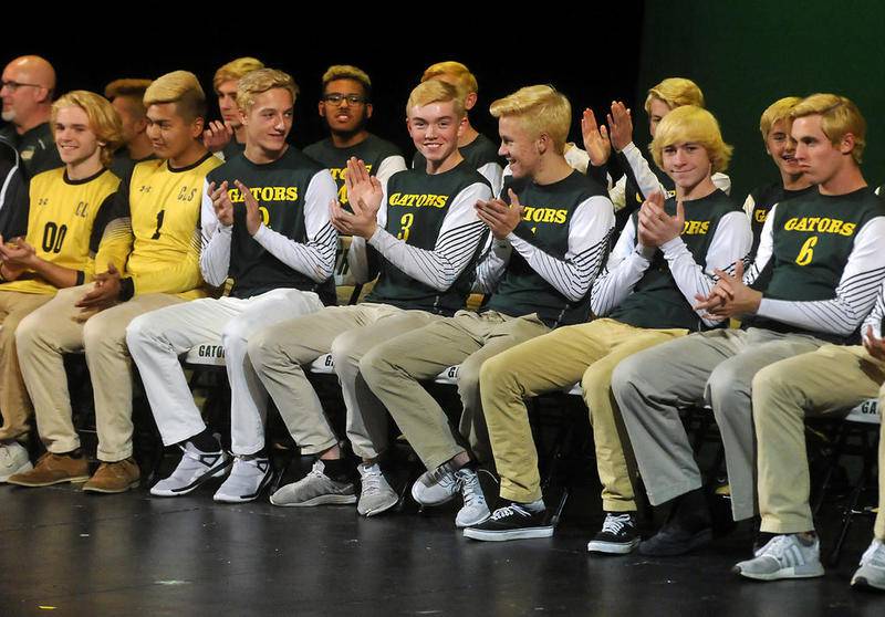 Crystal Lake South boys soccer players clap for their parents and fans during a celebration Thursday at Crystal Lake South High School. The Gators won the Class 2A state championship Saturday against Peoria Notre Dame.