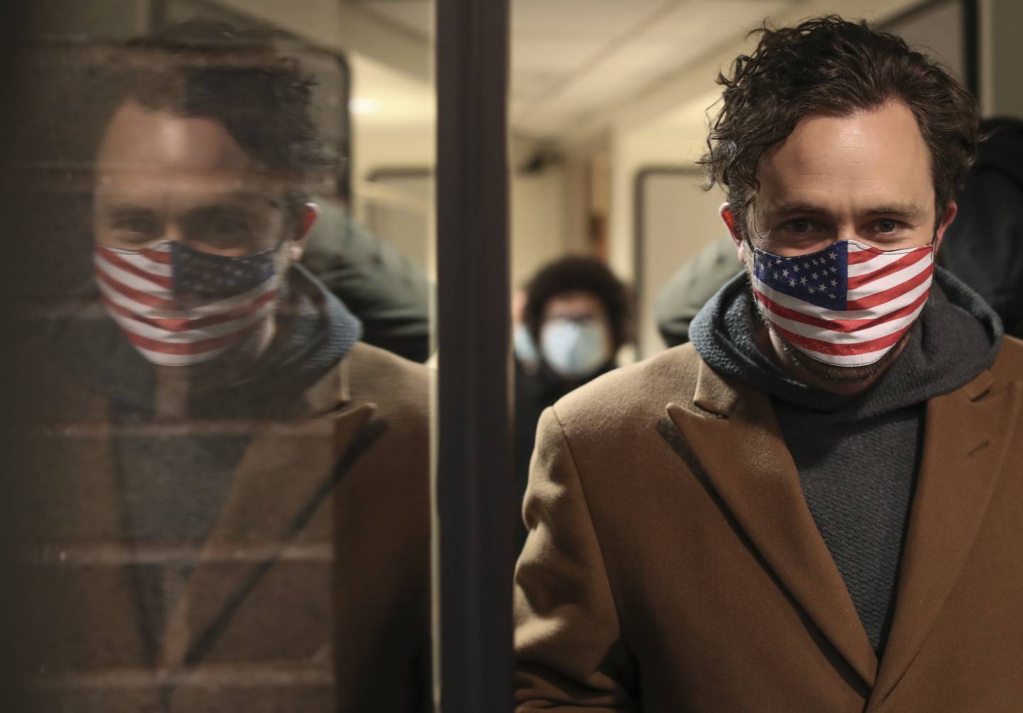 Hudson Hollister, a candidate for Joliet City Council, leaves the City Clerk's office after a rumored objection to most candidates on the ballot never materialized, on Tuesday, Dec. 29, 2020, at City Hall in Joliet, Ill.