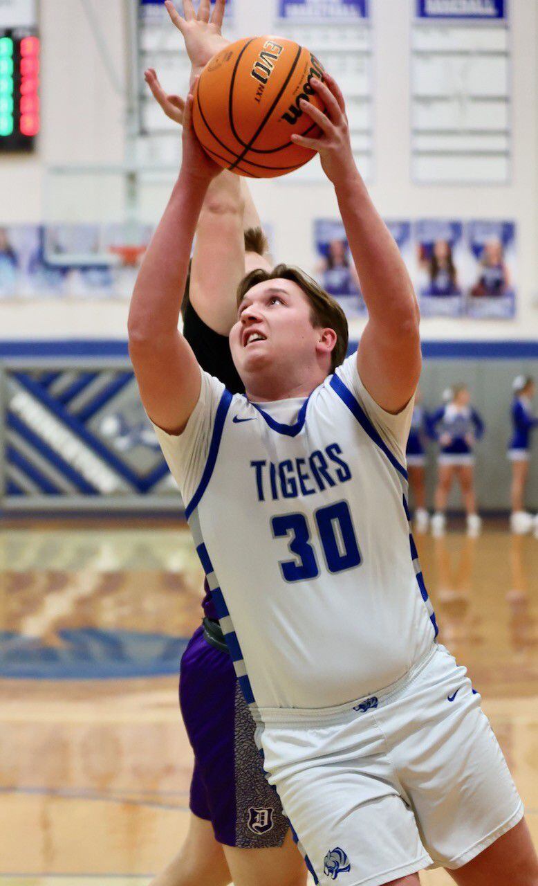 Princeton's Jordan Reinhardt shoots against Dixon Monday night at Prouty Gym. The Dukes won 61-50.