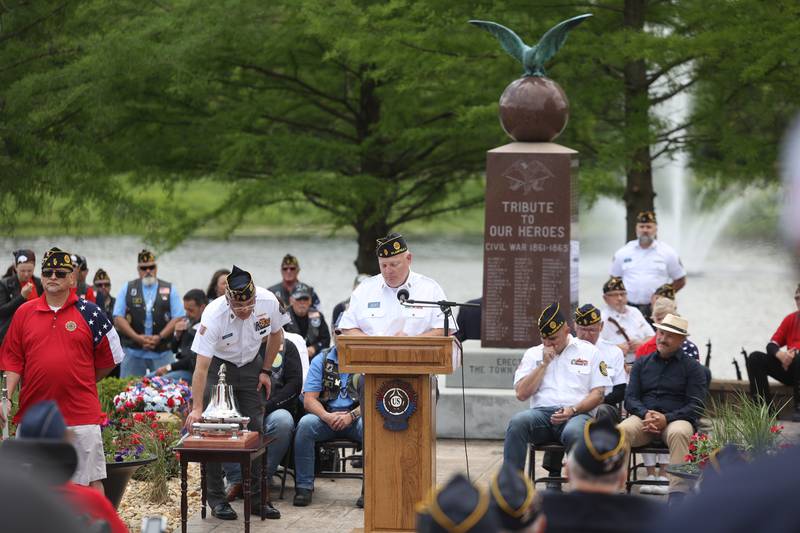 Brad Sellers of the American Legion Post 13 rings the bell as names of Plainfield natives who lost their lives in service are read at Plainfield’s Memorial Day and Ceremony event on Monday, May 27, 2024.