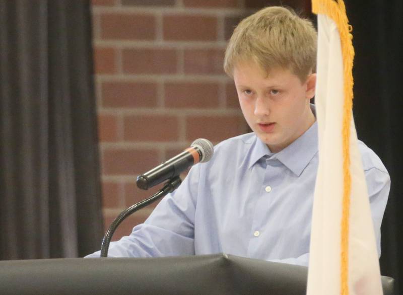 Student Nick Ambel reads his poem "Our Heroes" during the Parkside School Veterans Day Program on Friday, Nov. 10, 2023 at Parkside Middle School in Peru.