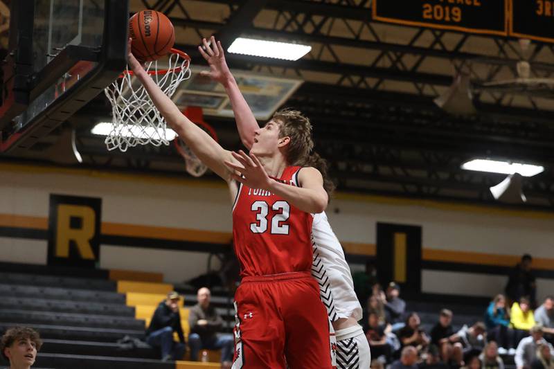 Yorkville’s Jason Jakstys lays in a shot against Joliet West in Joliet.