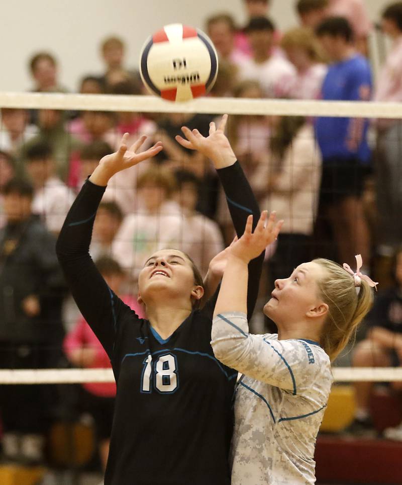 Woodstock North’s Gabriella Schefke collides with her teammate, Devynn Schulze, as they both go for the ball during a Kishwaukee River Conference volleyball match against Richmond-Burton Wednesday, Oct.11, 2023, at Richmond-Burton Community High School.