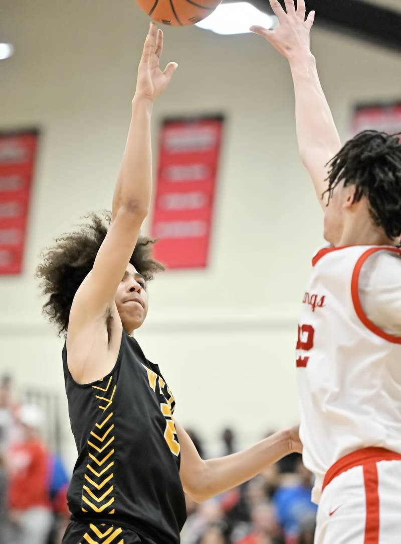 Joliet West's Corey Nobles shoots over Homewood Flossmoor's Gakobie Mcneal during the Class 4A sectional semifinal at Rich Township on Tuesday, Feb. 27, 2024, at Richton Park. (Dean Reid for Shaw Local News Network)