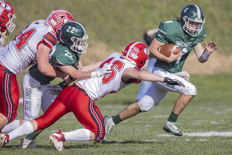 St. Bede quarterback John Brady tries to run the ball away from Forreston's Colin Kuhn (46) during a carry in the Class 1A first round playoff game on Saturday, Oct. 29, 2022 at the Academy in Peru.