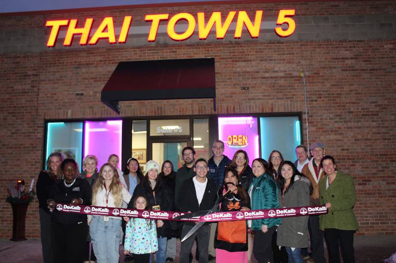 The DeKalb Chamber of Commerce celebrating Thai Town Sycamore's grand opening