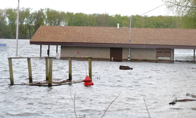 The Mississippi River continued to rise on Sunday continuing to flood the public dock in Albany.
