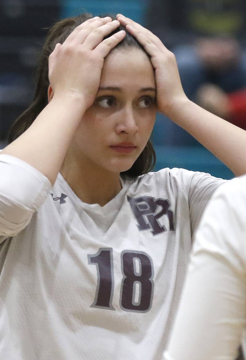 Prairie Ridge's Maizy Agnello waits for the third game to start during the Class 3A Woodstock North Sectional finals volleyball match on Wednesday, Nov. 1, 2023, at Woodstock North High School.