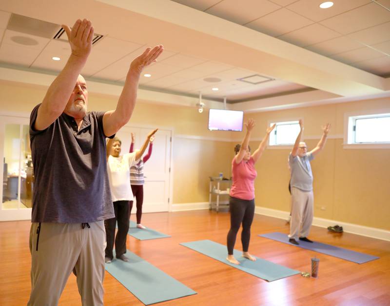 Lee Molitor of Geneva, who is in remission for bladder cancer, participates in a tai chi class for cancer patients, survivors and caregivers at the Northwestern Medicine Living Well Cancer Resource Center in Geneva.