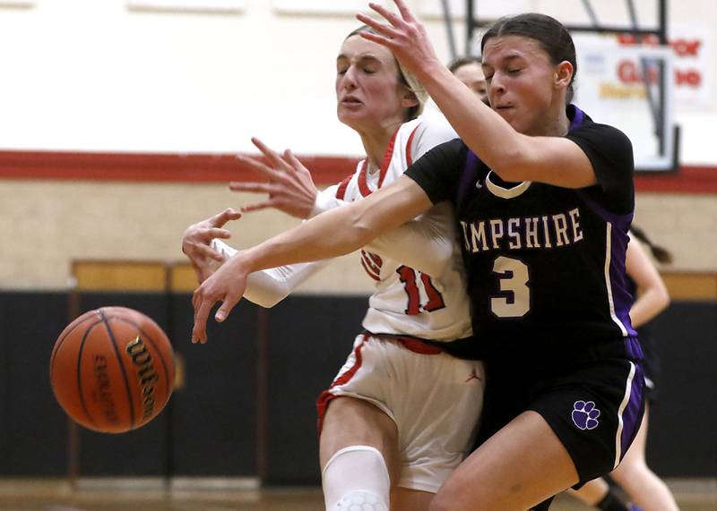 Huntley's Anna Campanelli looses the ball after being hit by Hampshire's Ceili Ramirez during a Fox Valley Conference girls basketball game Monday, Jan. 30, 2023, at Huntley High School.