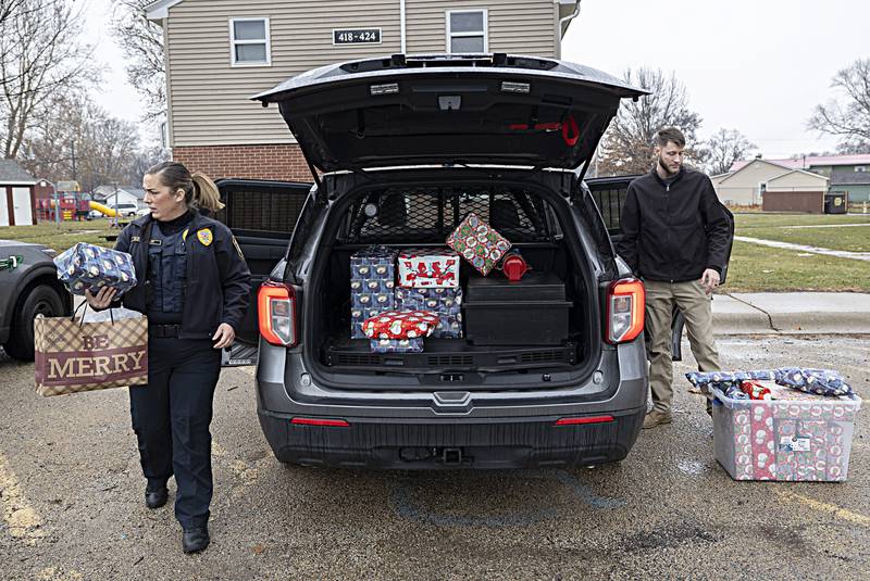 Rock Falls police’s Betony Gluff and Devin Teske make the first stop for Operation Santa Claus Friday, Dec. 22, 2023. The police and fire departments raised $7000 to supply gifts and other items to local families.