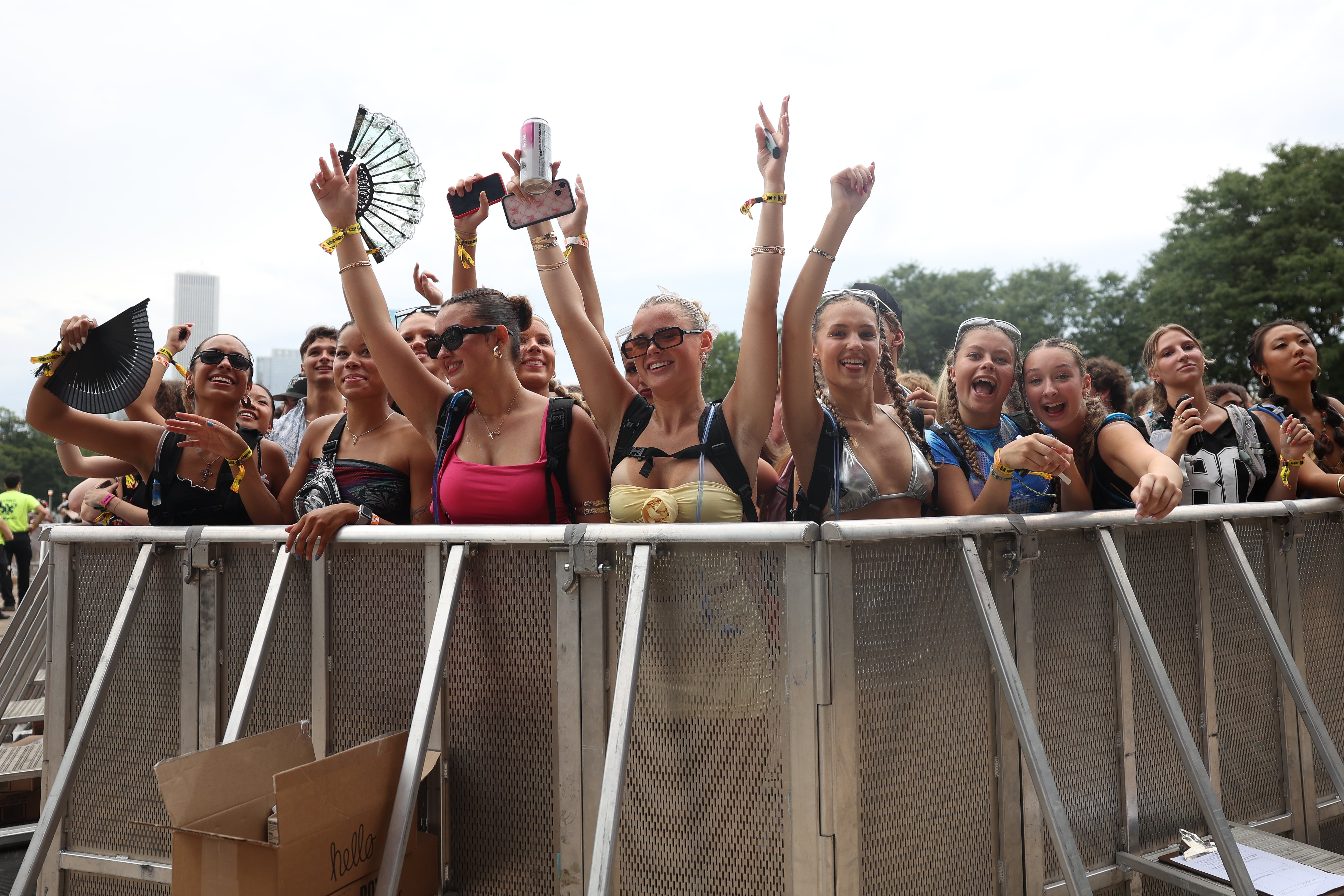 Fans dance to Brandi Cyrus, daughter of Billy Ray Cyrus and sister of Miley Cyrus, performing at Lollapalooza on Aug. 1, 2024 in Chicago.