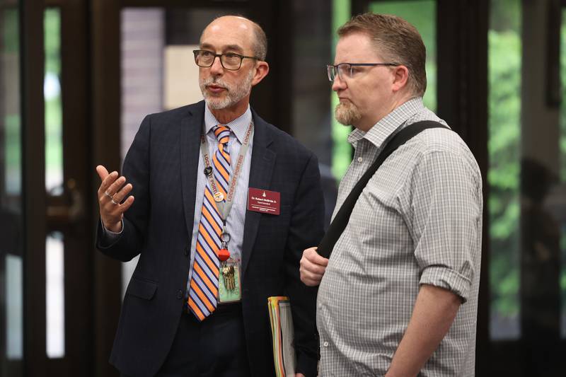 Superintendent Dr. Robert McBride Jr. speaks with Gaylord Building Historic Site Manager of Public Programs Clint Cargile, who is producing a podcast “Lockport UnLocked” while attending the LTHS Community Open House on Monday, May 13, 2024 in Lockport.