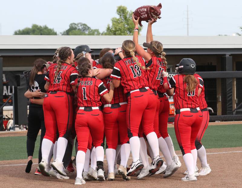 Members of the Yorkville softball team react behined hoome plate after defeating Oak Park-River Forest in thirteen innings during the Class 4A State semifinal softball game on Friday, June 9, 2023 at the Louisville Slugger Sports Complex in Peoria.