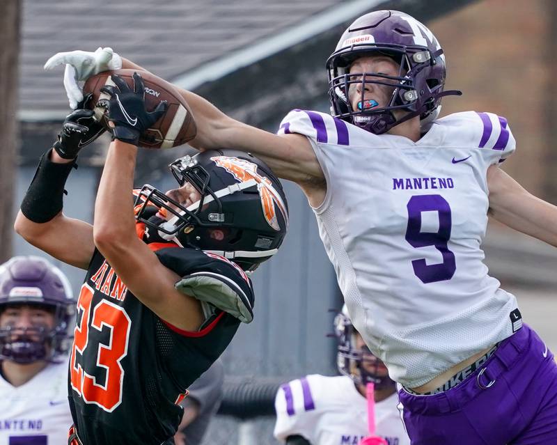 Sandwich Nate Hill (23) deflects a pass intended for Manteno's Aidan Dotson (9) during a football game at Sandwich High School on Saturday, Aug 26, 2023.