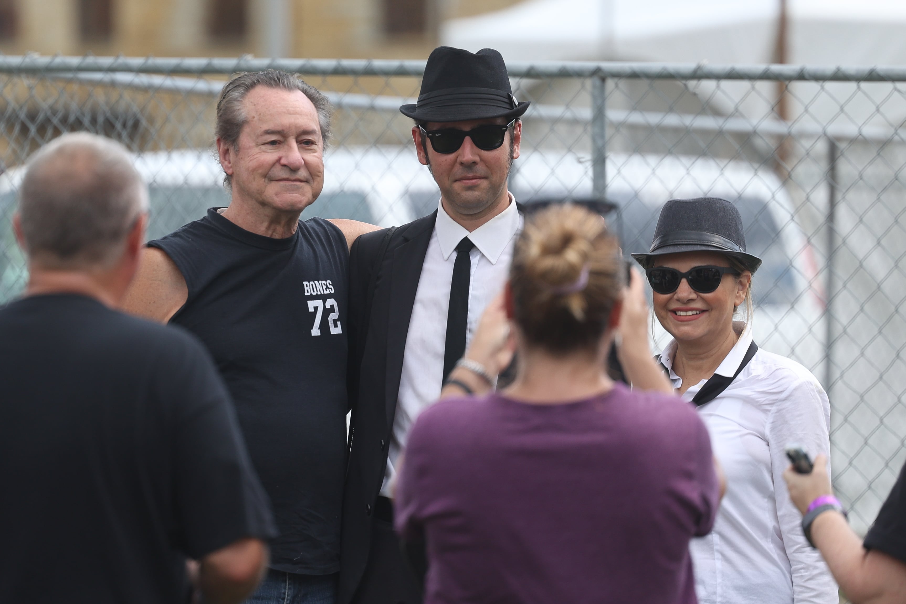 Tom “Bones” Malone poses for a photo with fans at Blues Brothers Con: The Sequel on Saturday, Aug. 17, 2024 at the Old Joliet Prison.