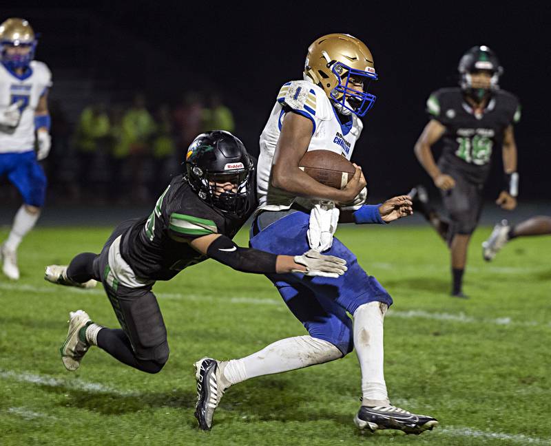 Rock Falls’ Korbin Oligney hauls down Rockford Christian QB Jaden Williams Friday, Sept. 22, 2023 in Rock Falls.