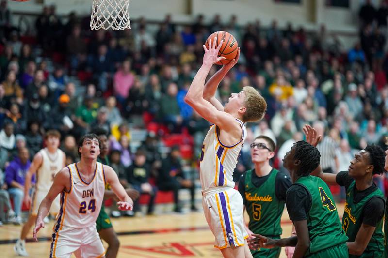 Downers Grove North's Alex Miller (25) shoots the ball in the post against Waubonsie Valley during a Class 4A East Aurora sectional semifinal basketball game at East Aurora High School on Wednesday, Feb 28, 2024.