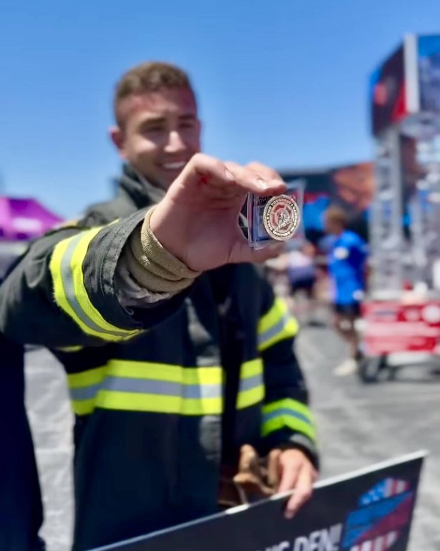 Princeton Fire Department Lieutenant Eli VanAutreve shows his Lion's Club coin after earning a spot in the coveted Firefighters' Challenge club competing at the Midwest Regional.