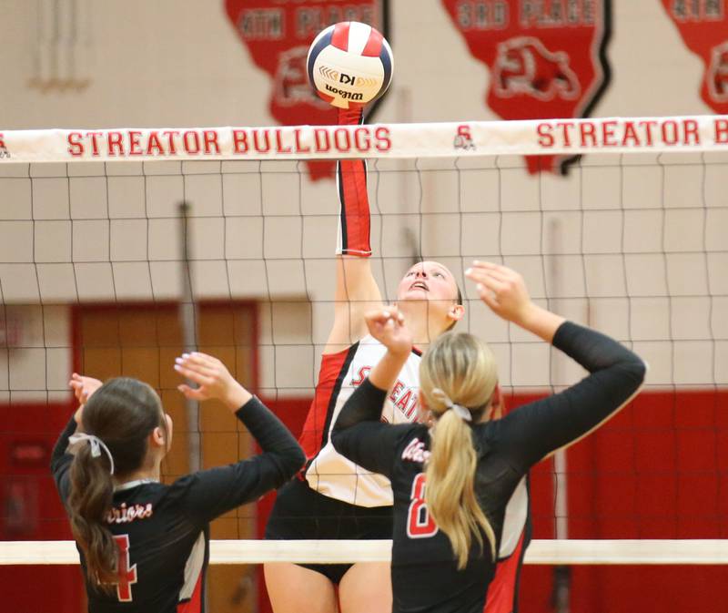 Woodland's Ella Derossett sets the ball in the air against Streator on Monday, Aug. 26, 2024 at Streator High School.