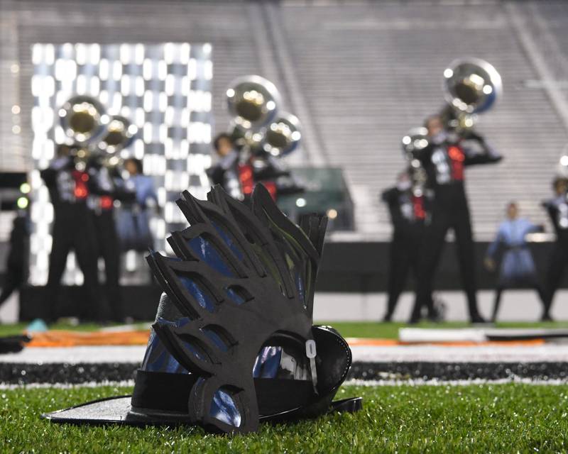 A ceremonial Cavaliers hat worn by the Rosemont-based drum corps rests on the ground during a performance at the Drum Corps International Midwest Classic on Saturday, July 13, 2024, at Northern Illinois University Huskie Stadium in DeKalb.