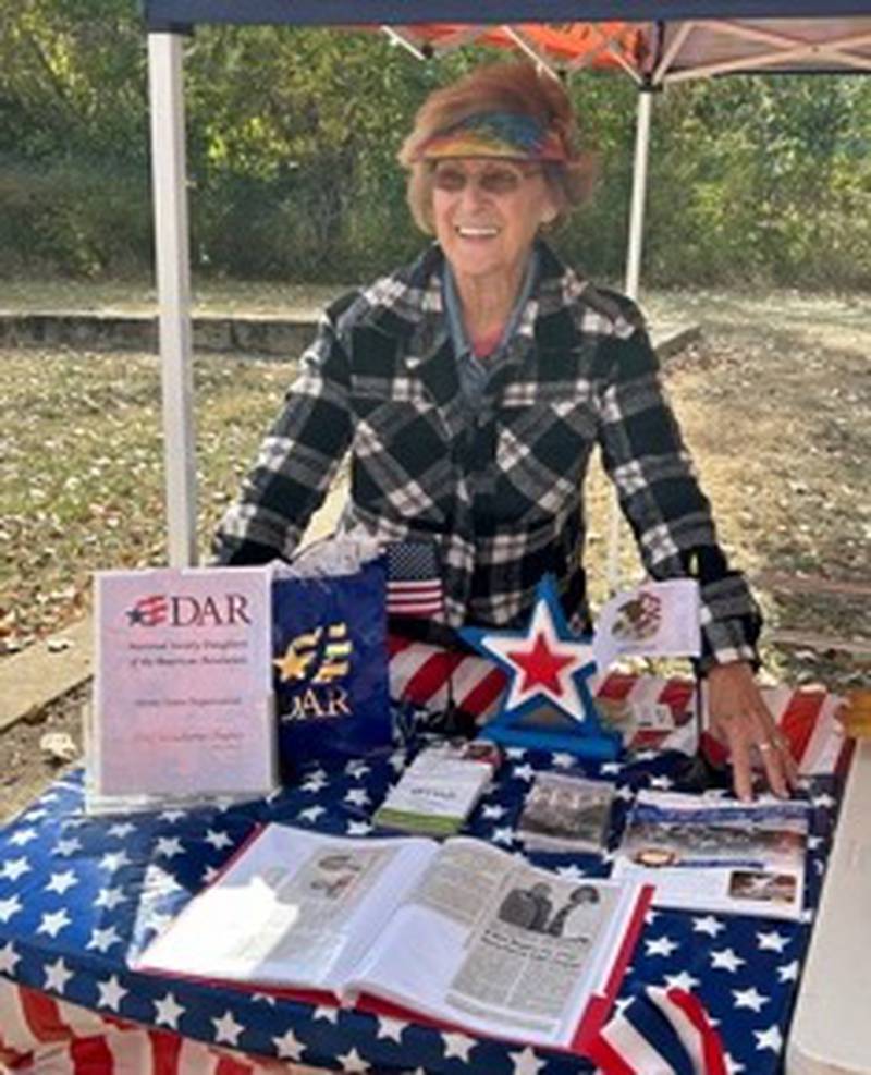 Sandy Miller, Putnam County resident, greets visitors at her table at the Toluca Coal Mine Association’s Coal Mine History Day on Oct. 13. Miller displayed items from the National Society Daughters of the American Revolution. Miller is a new member of the Chief Senachwine Chapter in Henry.