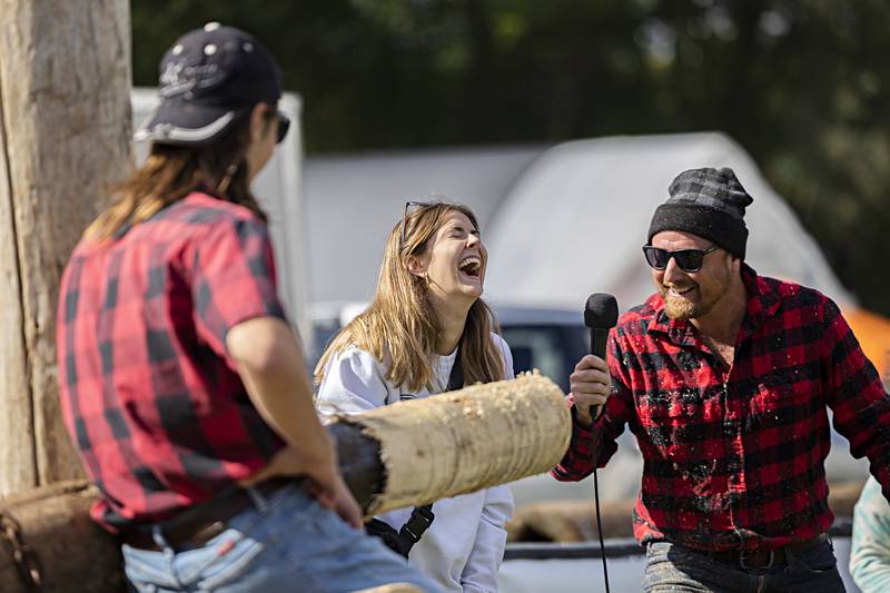 Tori Davis, laughs at her own impersonation of a chainsaw Saturday, Oct. 7, 2023 at the Rock Falls Tourism Lumberjack show.