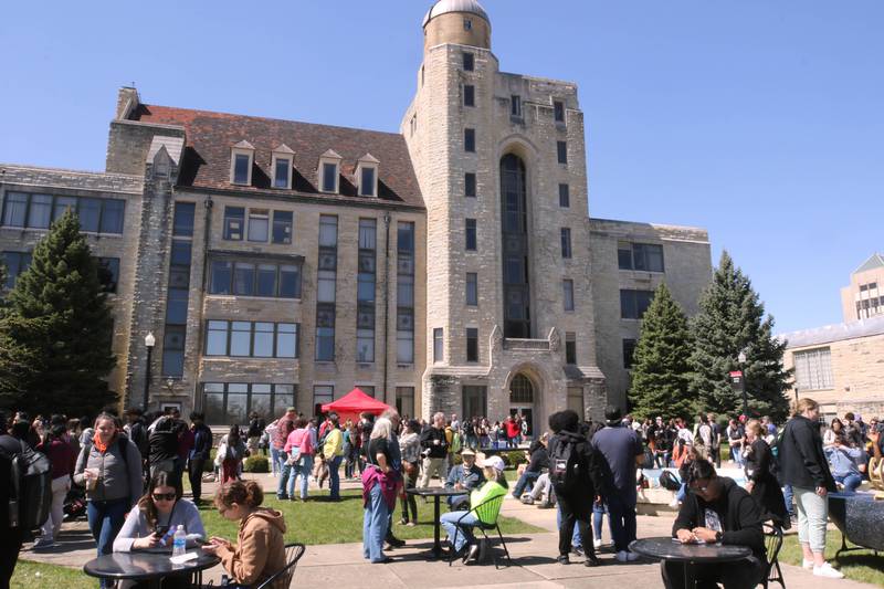 Attendees prepare to watch the eclipse Monday, April 8, 2024, during the Northern Illinois University Solar Eclipse Viewing Party behind Davis Hall at NIU in DeKalb. Attendees were treated to perfect weather to watch the rare celestial event.