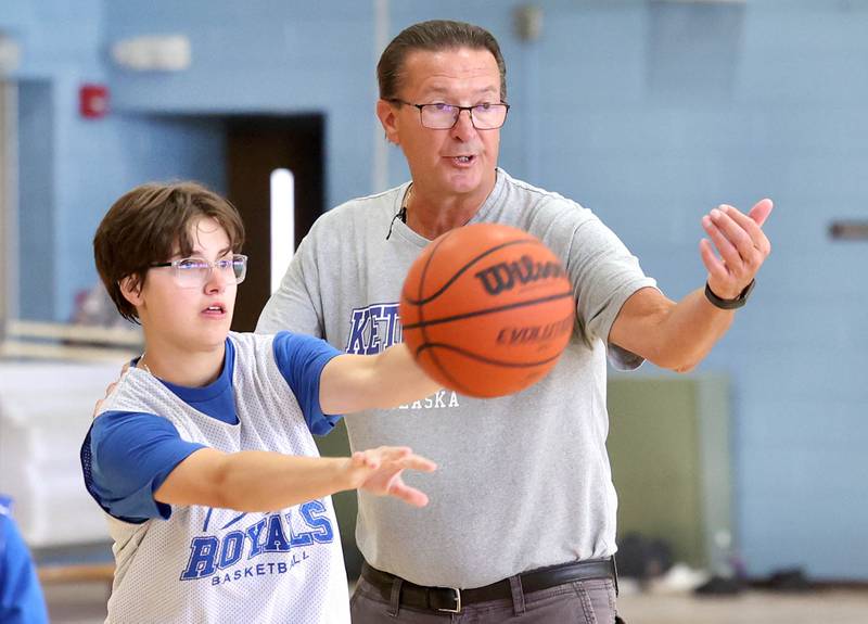 Hinckley-Big Rock new girls basketball head coach Bob Barnett teaches his team a play during practice Monday, June 10, 2024, at the school in Hinckley.