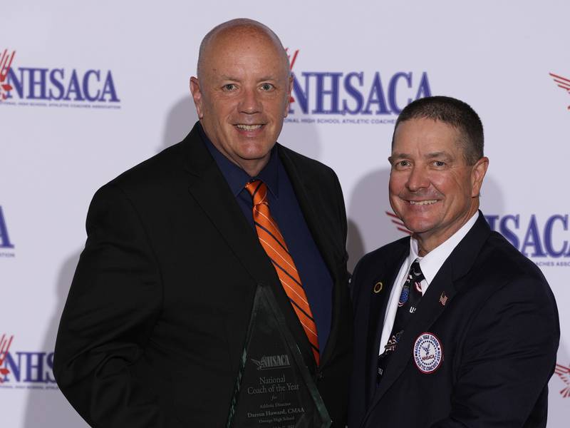 Oswego High School and SD 308 Athletic Director Darren Howard (left), pictured with Rocky Ruhl, President of the National High School Athletic Coaches Association, has been named the organization's national athletic director of the year.