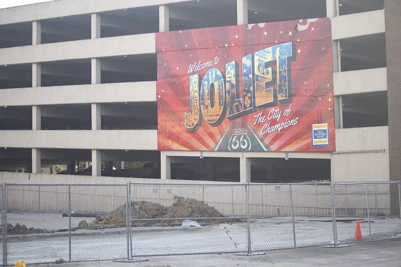 A construction zone near the fraying sign for the City of Joliet seen on Saturday, Sept. 13, 2024, outside the Ottawa Street parking deck in Joliet.